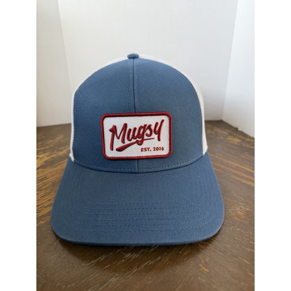 Mugsy Jeans blue and cream trucker hat with a red and white script logo patch